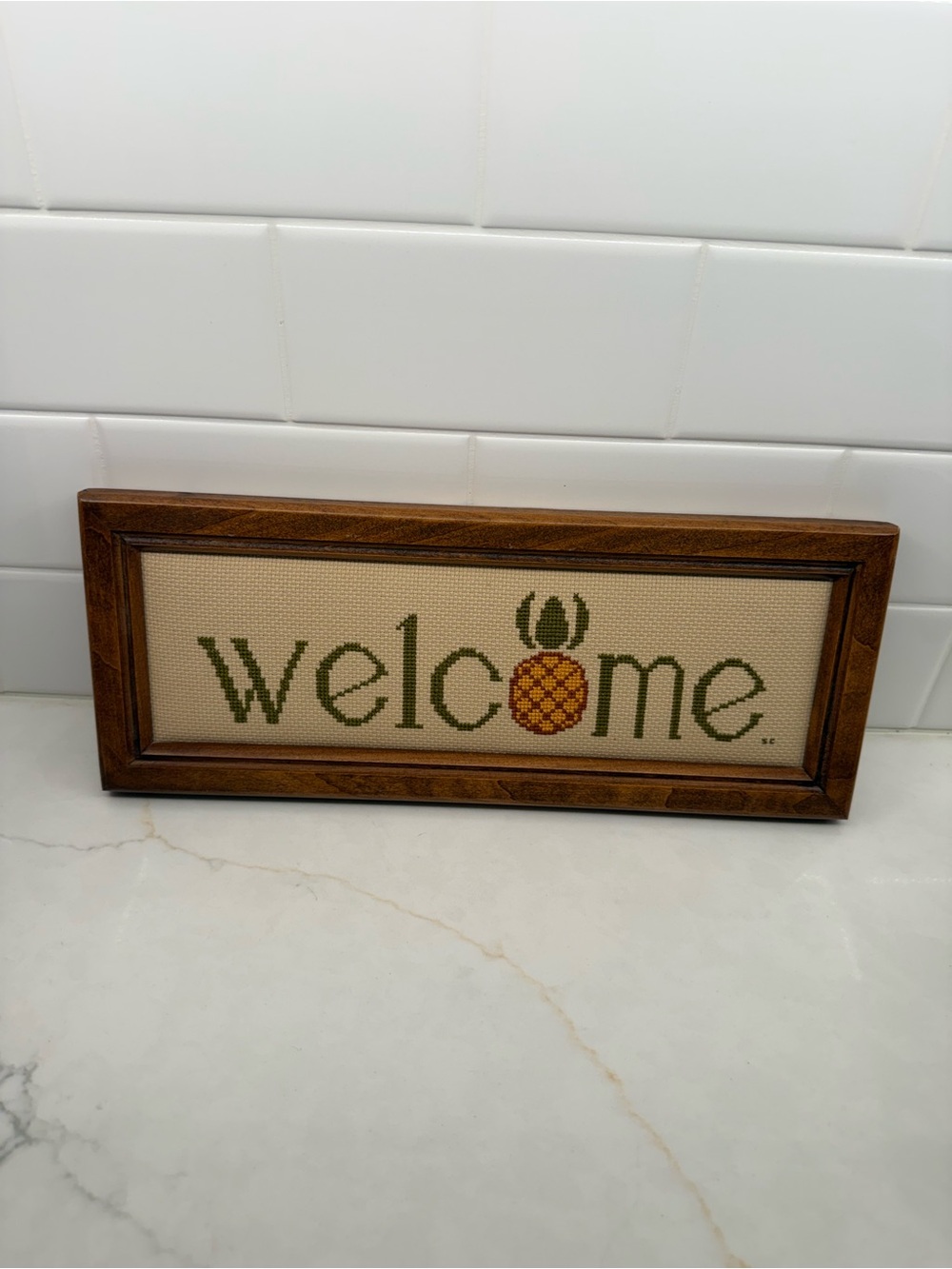 Cross stitch welcome sign with wood frame